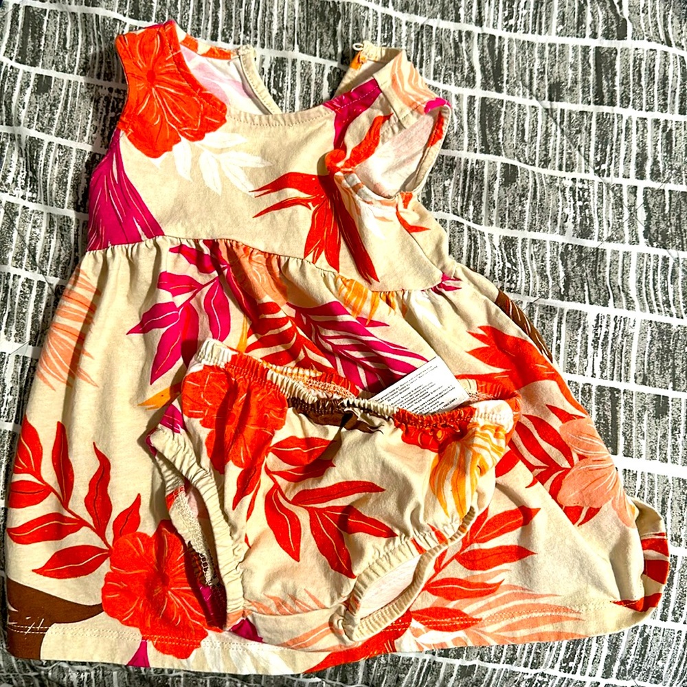 A pink orange tan dress with underwear on the bottom  12 months